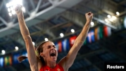 Yelena Isinbayeva reacts after winning the women's pole-vault final at the IAAF World Athletics Championships in Moscow on August 13.