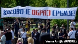 Far-right demonstrators, including members of the ultranationalist Oath Keepers organization, stage a rally in front of the national assembly in Belgrade under a banner declaring "Kosovo is the picture of Serbia." (file photo)