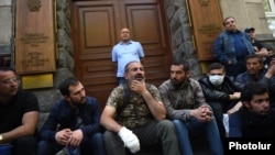 Nikol Pashinian (center) and his supporters block the entrance to the Central Bank building in Yerevan on April 17.