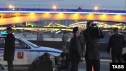 Police search the area where Yamadayev was found dead in his car.