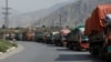 Trucks loaded with supplies bound for Afghanistan are seen stranded at the Michni check post in Torkham, Pakistan, on September 7.