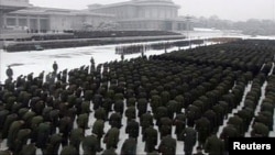 Uniformed personnel stand in formation outside the Kumsusan Memorial Palace during Kim Jong Il's funeral procession in Pyongyang 