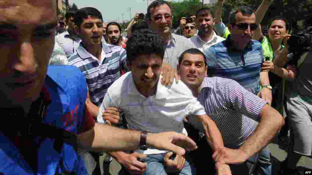 Activists attempted to use Baku&#39;s 2012 stint as Eurovision host as an opportunity to call attention to the regime&#39;s dismal rights record. Here, plainclothes police officers detain protesters outside Azerbaijan&#39;s public television station during the week of the Eurovision broadcasts. &nbsp;