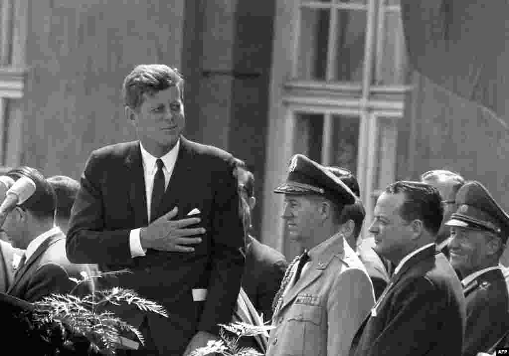 President Kennedy gives a speech at the Schoeneberg city hall in Berlin on June 26, 1963. It was here that he made his famous statement, &quot;Ich bin ein Berliner&quot; (I am a Berliner) to underscore U.S. support for West Germany and empathy for people living in the divided city of Berlin.