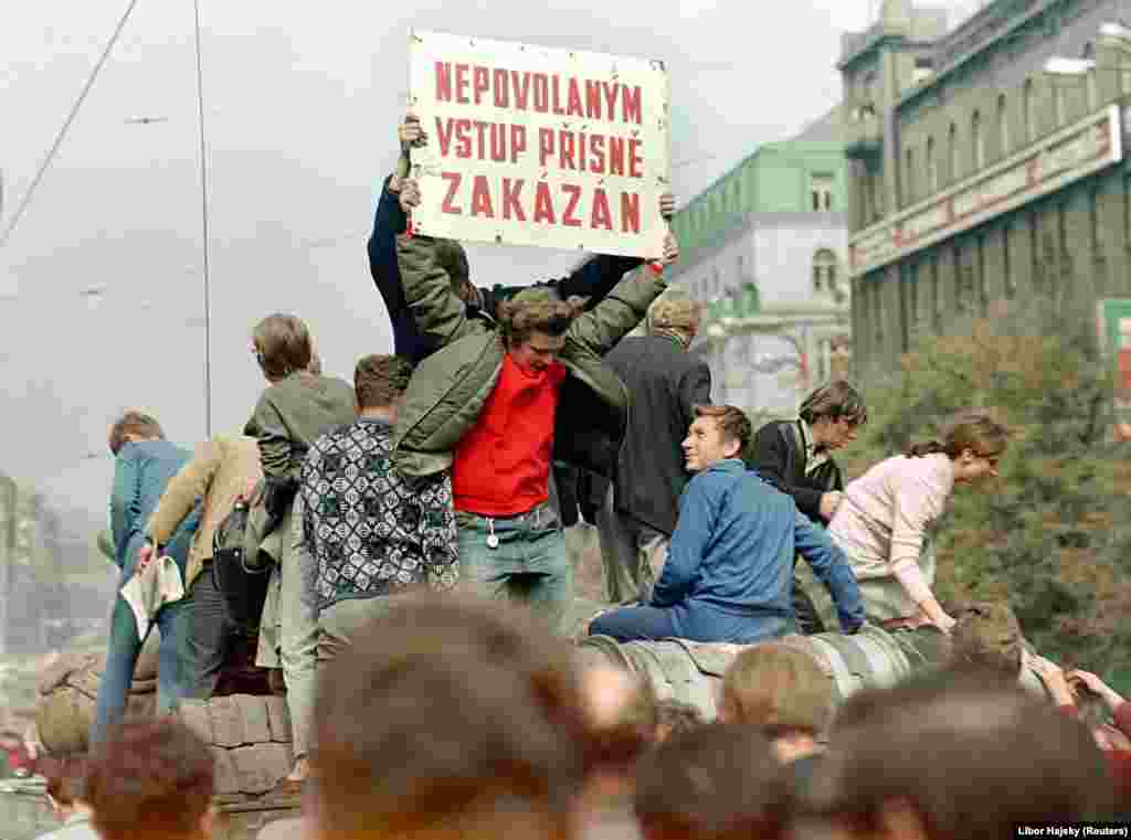 The lighthearted atmosphere on the streets at this time is evident in the sign saying, &quot;Unauthorized Access Strictly Prohibited,&quot; which these young people had commandeered from a nearby building site. &quot;They rode on the tank employing this typical dark Czech humor,&quot; Hajsky says. &quot;People were smiling. At that moment, they still saw it as some sort of spectacle.... But then, of course, things began to go in a different direction...&quot;