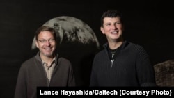 Russian astronomer Konstantin Batygin (right) and his colleague Mike Brown (left) have published their research in the hope that the public can help them find our solar system's "ninth planet."