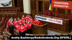 Ukrainian opposition politicians have occupied the parliament's podium for more than two weeks. 