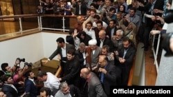 Ex-President Ali Akbar Hashemi Rafsanjani (center, with white turban) arrived at Iran's Interior Ministry within minutes of the official close of registration for would-be candidates on May 11.