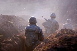 Armenian soldiers take their position on the front line in the Tavush region on July 14.