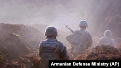 Armenian soldiers take their position on the front line in Tavush region last month.