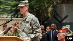 General Stanley McChrystal addressing NATO troops and dignitaries in Kabul in June