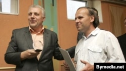 Belarus journalist Henadz Barbarych (right) was briefly detained today by the KGB. He is pictured here in 2007. 