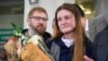 Maria Butina, who served nine months in a U.S. prison for acting as a Russian government agent, arrives at Moscow's Sheremetyevo airport on October 26, a day after her release. 