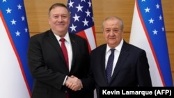 U.S. Secretary of State Mike Pompeo (left) shakes hands with Uzbek Foreign Minister Abdulaziz Kamilov in Tashkent on February 3.