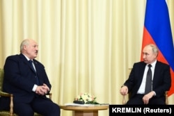 Russian President Vladimir Putin listens to Belarusian President Alyaksandr Lukashenka during a February 17 meeting on the outskirts of Moscow.