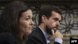 Facebook chief operating officer Sheryl Sandberg (left) and Twitter chief executive officer Jack Dorsey testify during a Senate Intelligence Committee hearing on September 5. 