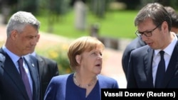 German Chancellor Angela Merkel (center) speaks with Serbian President Aleksander Vucic (right) and Kosovar President Hashim Thaci during the EU-Western Balkans summit in Sofia on May 17.