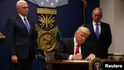 U.S. President Donald Trump signing the executive order on immigration at the Pentagon on January 27.