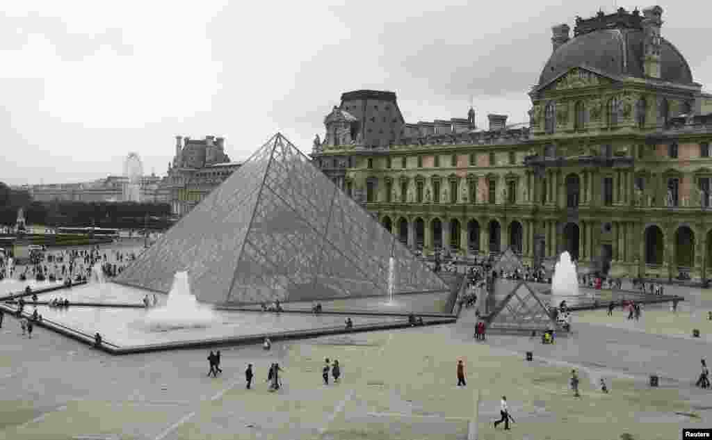 The Louvre Pyramid in Paris was designed by architect I.M. Pei and opened to the public in 1989. At the time, the design of the modern glass pyramid -- set smack dab amid the classical lines of the old Louvre building -- upset many critics and members of the public. It has ultimately become a tourist attraction in its own right and one of the must-sees for visitors to Paris now.