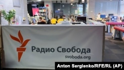 Journalists work at RFE/RL's bureau in Moscow. The EU said the "foreign agent" and other laws "have the clear intention to hamper RFE/RL's operations in Russia as part of a wider trend to stifle independent media and critical voices in the country."