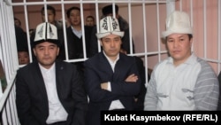 Opposition leaders Kamchybek Tashiev, Sadyr Japarov, and Talant Mamytov (left to right) in court in Bishkek earlier in January.