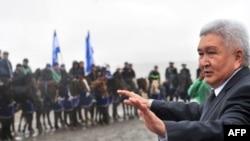 Feliks Kulov addresses a preelection rally outside Bishkek on October 8.