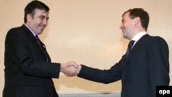 Georgia's Mikheil Saakashvili (left) meets Russian President Dmitry Medvedev in St. Petersburg in June