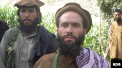 A Pakistani Taliban commander talks with journalists in the Bajaur tribal region, where the militants have a strong presence.