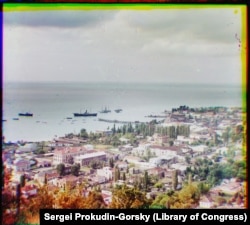 A view over Sukhumi with some steamships anchored in its harbor