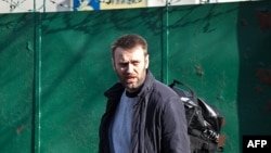 Opposition leader and anticorruption blogger Aleksei Navalny leaves a detention center in Moscow on March 6.