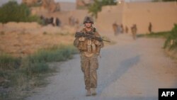 A U.S. Marine patrols in Afghanistan's southern Helmand Province. U.S. officials have said a residual U.S. presence after 2014 could range from a few thousand to 20,000 troops.