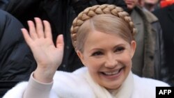 Ukraine's prime minister and presidential candidate Yulia Tymoshenko smiles as she greets people after casting her vote in her hometown of Dnipropetrovsk.