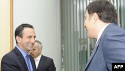 U.S. Assistant Secretary of State Phillip Gordon (left) being greeted by Georgian President Mikheil Saakashvili in Tbilisi in June.