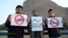 Iranians protested after Afghans living in the city of Isfahan were denied access to a public park. One of the signs reads, "I Am Also An Afghan." (file photo)