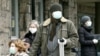 People wait for a coronavirus test outside a state hospital in the Bosnian capital, Sarajevo. 