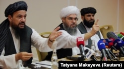 Taliban representatives Abdul Latif Mansoor (left to right), Shahabuddin Delawar, and Suhail Shaheen hold a news conference in Moscow on July 9.