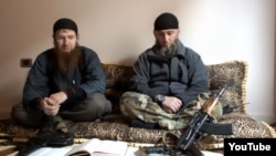 Abu Umar al-Shishani (left) is thought to be among IS militants besieging the Syrian town of Kobani. (file photo)