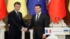 Ukrainian President Volodymyr Zelensky (right) and French President Emmanuel Macron attend a news briefing following talks in Kyiv on February 8.