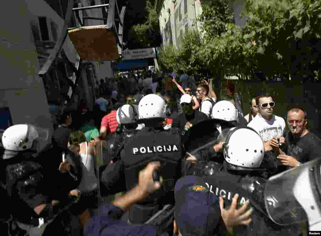 Police clash with protesters during the gay-pride parade in Budva.