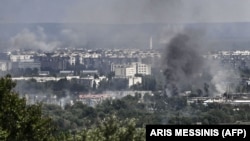 Smoke and dirt rise from the city of Syevyerodonetsk during fighting between Ukrainian and Russian troops on June 17.