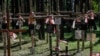 Wooden crosses with Polish national flags fill the Polish military cemetery in Mednoye, in Russia's Tver region north of Moscow.