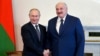 Russian President Vladimir Putin (left) and Belarusian President Alyaksandr Lukashenka shake hands during a meeting in St. Petersburg on July 13. 