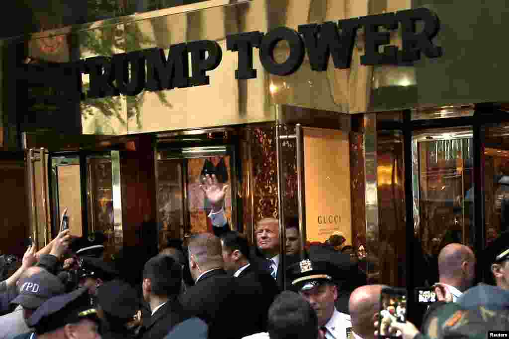 Trump waves to supporters outside Trump Tower in Manhattan on October 8, 2016, one month before his election victory.