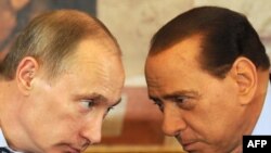 Italian Prime Minister Silvio Berlusconi (right) and his Russian counterpart, Vladimir Putin, confer during Putin's visit to Italy on April 26.