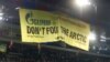 Greenpeace activists deploy a banner to protest against Russia's Gazprom during the Champions League soccer match in Basel on October 1. Gazprom is a sponsor of the competition, as well as German club FC Schalke, which was playing FC Basel.