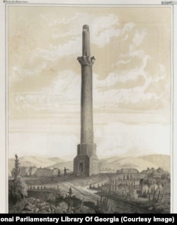 Two men at the base of the Shamkir Minaret in Azerbaijan. The structure, which collapsed into rubble sometime before 1861, was reportedly 60 meters tall. It is believed to have served as a military watchtower and was built around the 11th century.