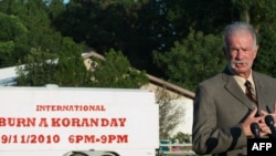 Dove World Outreach Center Pastor Terry Jones updates the media outside his church.