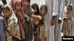 Children displaced by fighting await humanitarian aid in one of Pakistan's tribal districts. The government has failed to back its counterinsurgency with development efforts to win public support. 