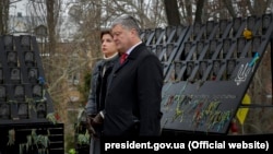 Ukrainian President Petro Poroshenko and his wife take part in a ceremony marking the fifth anniversary of the Euromaidan protests in Kyiv on November 21.