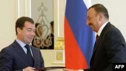 Russian President Dmitry Medvedev (left) at signing ceremony with Azerbaijani President Ilham Aliyev in Baku on June 29.